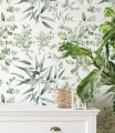 Biała tapeta w zielone liście idealna do delikatnego wystroju pomieszczenia