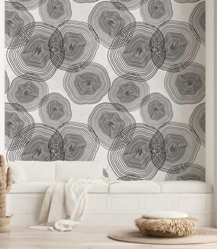 Tapeta w szare i czarne, nieregularne okręgi, które przypominają przekrój pnia drzewa, umieszczone na białym tle