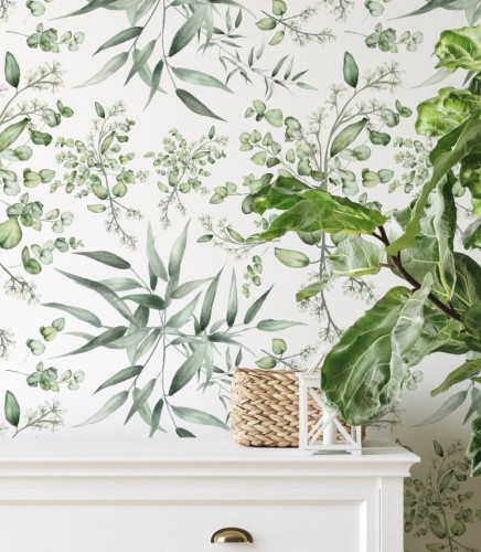 Biała tapeta w zielone liście idealna do delikatnego wystroju pomieszczenia