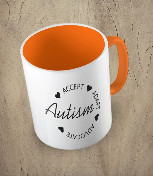 Pomarańczowy kubek autism accept adapt advocate