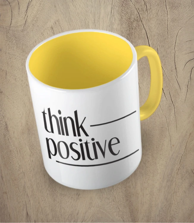 Żółty kubek think positive