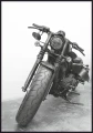 Plakat ze starym motocyklem.