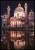 Fotografia zabytkowej i pięknie oświetlonej katedry wraz z jej odbiciem w tafli wody
