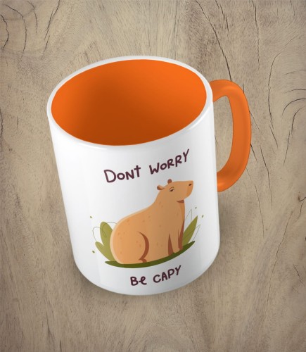 Pomarańczowy kubek don't worry be capy